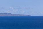 The exotic sight of the island of Molokai in the horizon